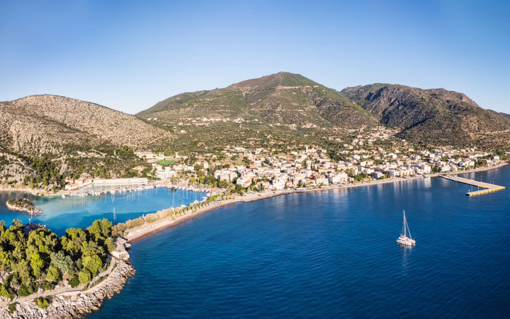 Aerial view of Methana peninsula coastline and seaside town, Peloponnese