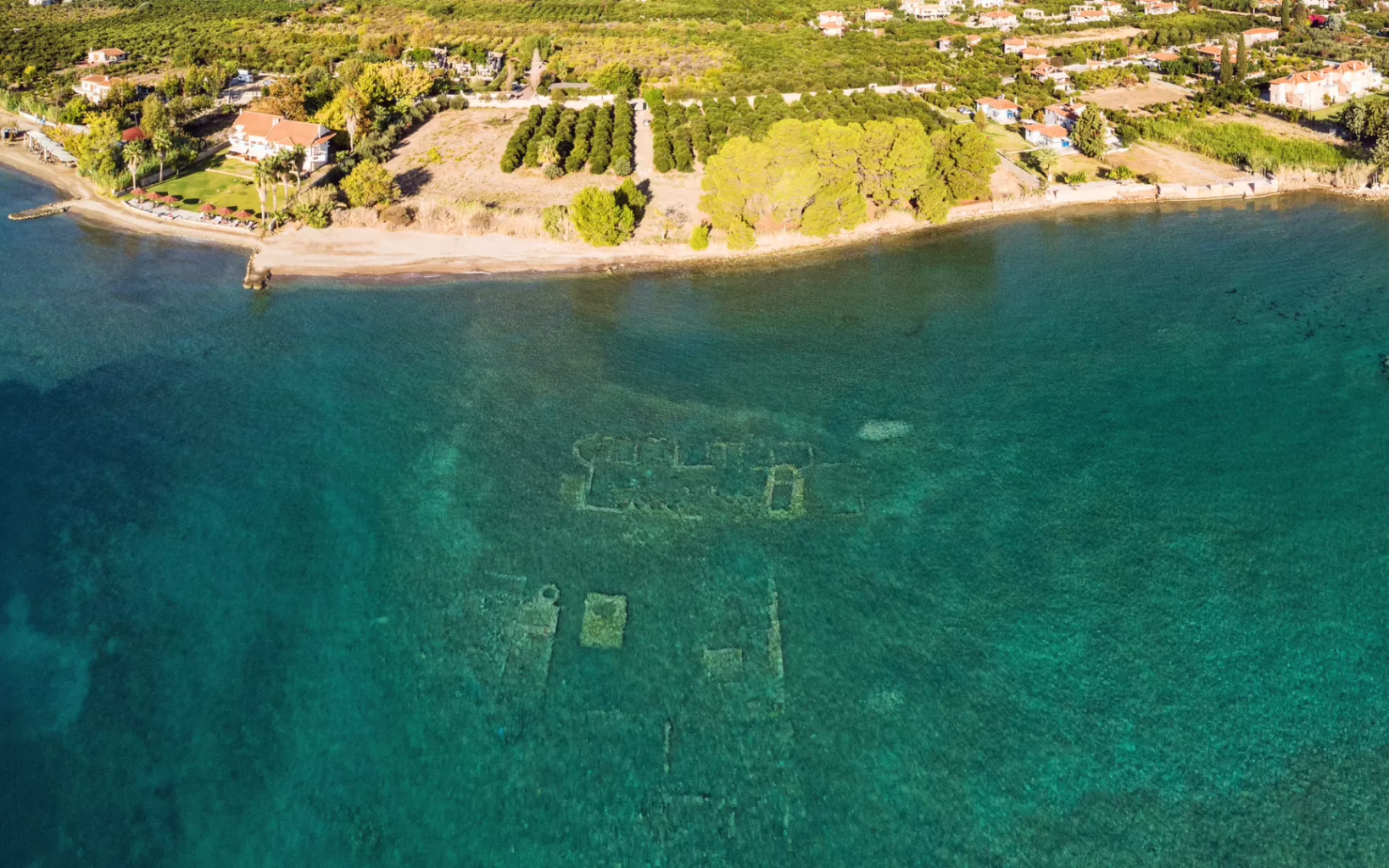 Aerial view of the sunken ancient city near Epidaurus beneath clear turquoise waters, Peloponnese